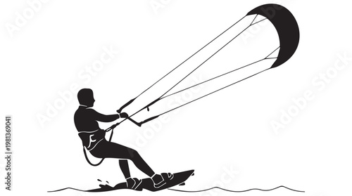 Silhouette of kitesurfer riding waves at sunset with dramatic sky and water reflection