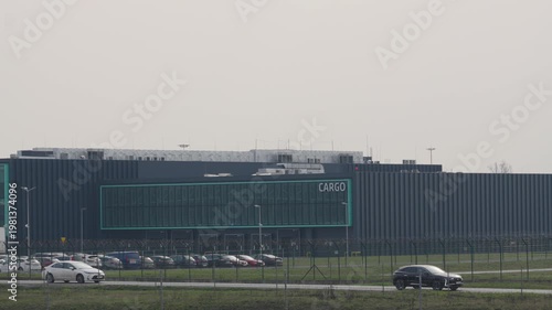 Exploring the sleek cargo facility at sunrise, where the hum of progress meets the promise of adventure