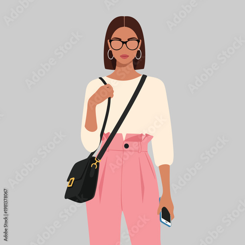 Portrait of a Stylish Woman Using a Smartphone and Carrying a Crossbody Bag
