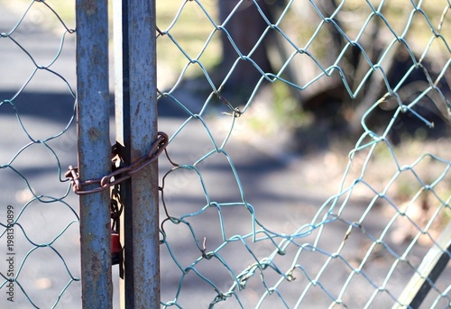 Hole in the fence metal mesh fence photo