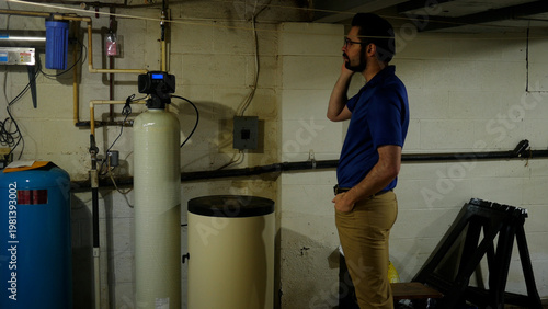 A Plumbing or Well Specialist Makes a Call to his Company on Job Site