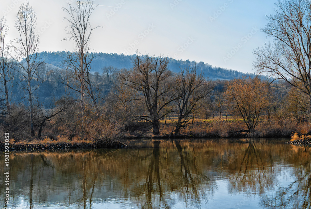 Fototapeta premium River, trees, hills on the horizon, spring landscape