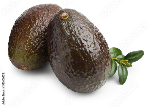 Fresh ripe avocados and green leaves isolated on white