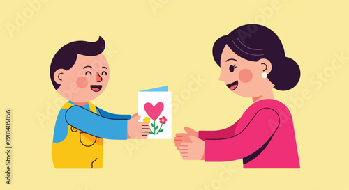 A young boy happily giving a handmade greeting card with a heart and flower design to a smiling woman, likely his mother, on a light yellow background.