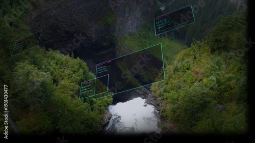 Camera descending over canyon waterfall receiving cyan holo panels shifting aligning for mapping