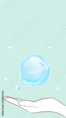 手のひらに浮かぶ水の球体とキラキラ光っている光