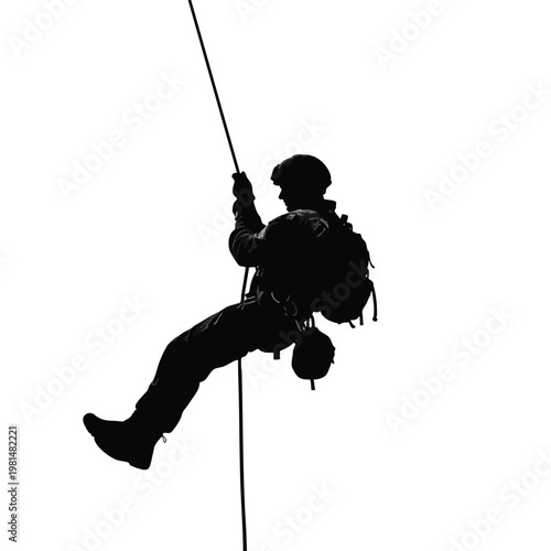 Silhouette of a Climber Scaling a Rope on a Mountain