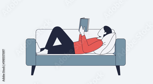 Person relaxing on a sofa while reading a book, enjoying a moment of quiet leisure.