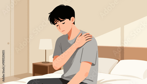 Young man sits on bed, holding shoulder. He appears pained, possibly injured or stressed. Soft lighting creates calm, quiet atmosphere. Ideal for health, wellness, or stress-related content