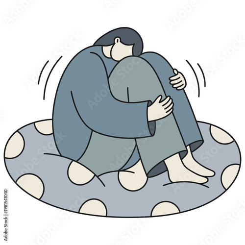 Person curled up in distress on a cushion.