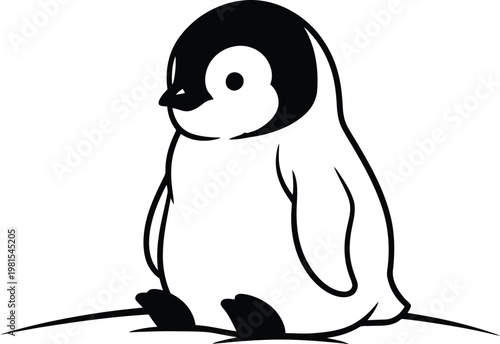 Cute little penguin sitting on the ground looking around curiously