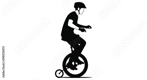 A cyclist riding a unicycle captured in a striking black silhouette