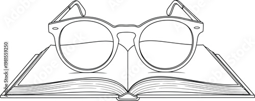 Glasses resting on an open book with cat ear design on temples