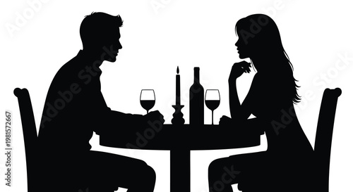 Silhouetted couple enjoying a romantic dinner at a candlelit table