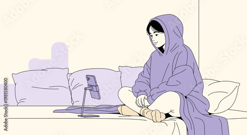 Cozy Person Relaxing on Bed with Tablet, Wearing Oversized Hoodie