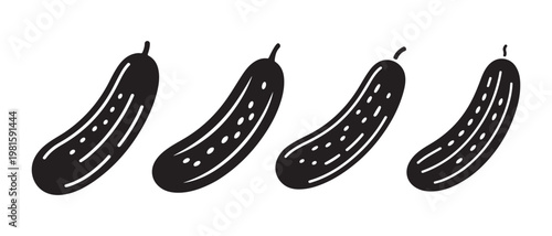 Black and White Cucumbers in a Row on White Background.