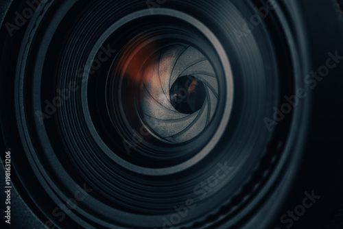 Close-up of a Camera Lens Aperture Blades with Mechanical Detail,Macro,A detailed, high-angle macro shot focusing on the iris diaphragm of a professional camera lens. The image showcases.