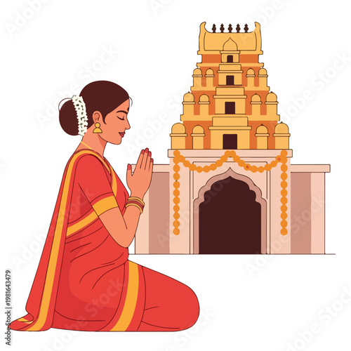 Indian woman in a red sari praying in front of a traditional Hindu temple structure