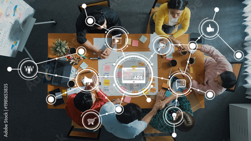 Tableau sur toile A diverse team engages in a strategic marketing session, showcasing collaboration and creativity with digital tools and brainstorming methods for effective advertising strategies