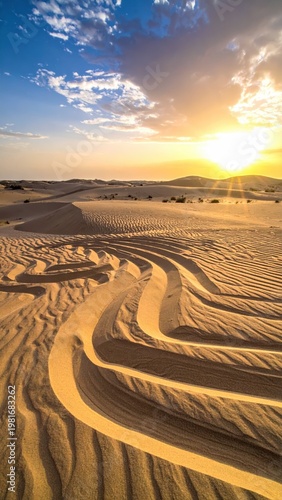Serene Sunset Over Flowing Sand Dunes in the Desert Landscape