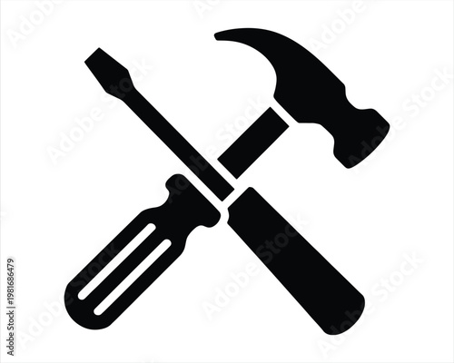 Hammer and Screwdriver icon. in a white background. flat icon of crossed hammer and screwdriver