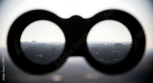 Searching the horizon A focused binocular view of a sprawling metropolitan area under haze