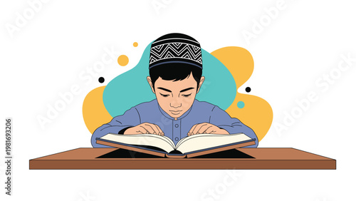 Diligent boy wearing a traditional Kufi cap sits at a wooden table and reads a large open book with deep and quiet concentration.