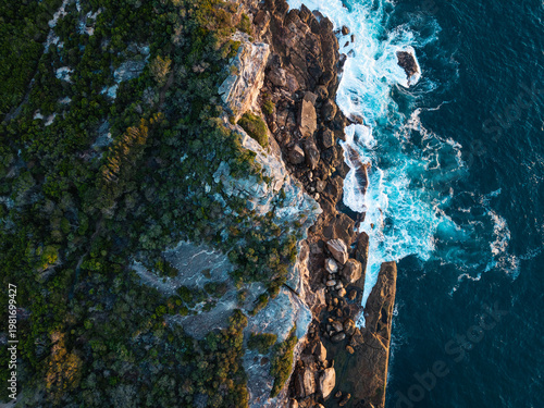 Top down view of ocean cliff.