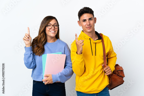 Schilderij op canvas Young student couple isolated on white background intending to realizes the solu