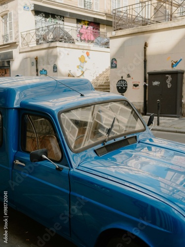 Classic Blue Vintage Small Delivery Van Parked on a Picturesque European Street