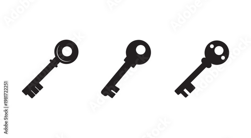 Three black keys with different shapes on white background  old fashioned metal keys