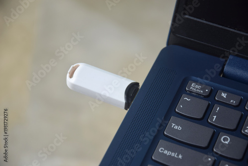 Flash drive is connected to the laptop via the USB port	