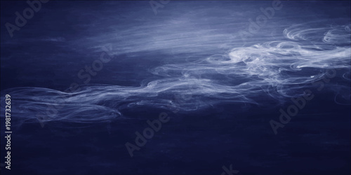 Dark stormy clouds gather over the deep blue ocean horizon as sunset light reflects on the waves of this moody nature seascape landscape