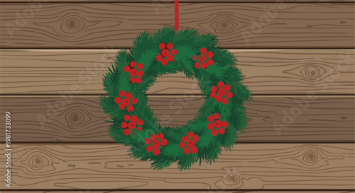 Evergreen wreath with red berries hangs on rustic wood plank background