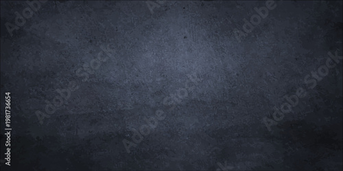 Dark blue grunge wall texture with a vintage black chalkboard surface and blank old paper pattern for a dark grey textured backdrop design