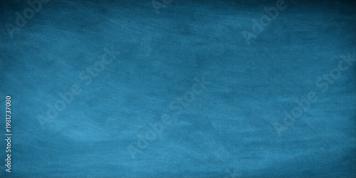 A vintage blue grunge texture background featuring an aged rough paper surface and dirty paint patterns on an old canvas wall backdrop for design