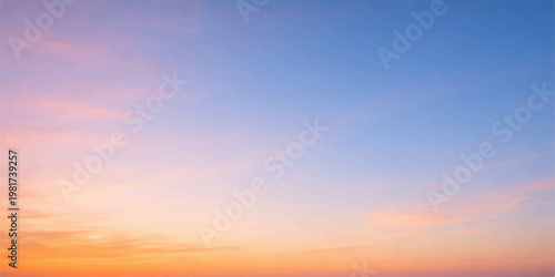 A beautiful abstract nature landscape featuring a vibrant sunset sky with orange and blue clouds as the evening sunlight creates a colorful dusk cloudscape
