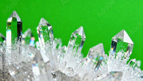 Extreme macro photography of sharp medical drug crystals growing with translucent textures and refractive edges isolated on a solid bright chroma key green screen background for pharmacy ads