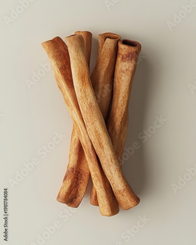 A stylish arrangement of dog chews, featuring six natural, bone-shaped treats with a light brown color.