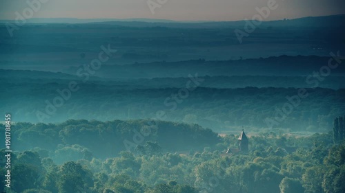 Green landscape with church in Lorry Mardigny village, France. Time lapse