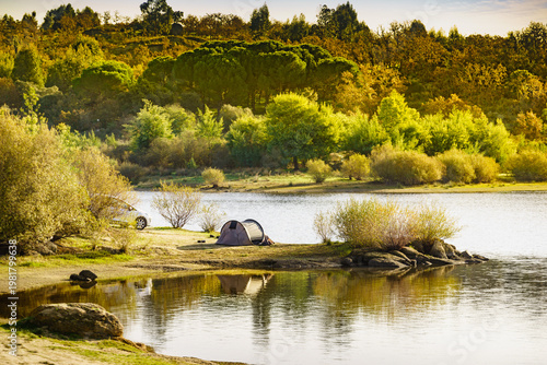 Tent on lake shore. Camping on nature. Alentejo Portugal.