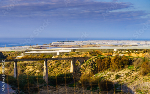 Plastic greenhouses on coast, Spain