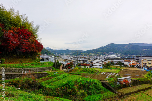 Rural village and farmland with autumn colors along Shikoku Henro route in Japan