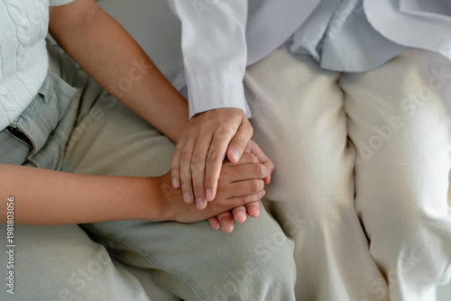 Close up of professional holding patient hand.  Empathy, mental health, support and consolation