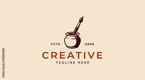 A vintage-inspired logo design for creative arts, featuring a paintbrush immersed in a pot of paint, symbolizing artistry and creativity in a minimalistic style.