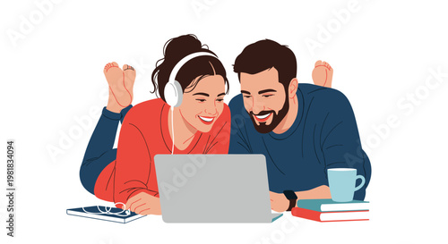 Happy couple lying on their stomachs and looking at a laptop screen together while studying or watching a movie at home.
