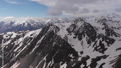 Caucasus, North Ossetia. Adaykom Gorge. Rocky, snow-capped mountains.