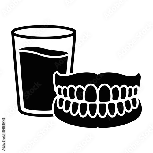 Vector of dentures next to a glass of water