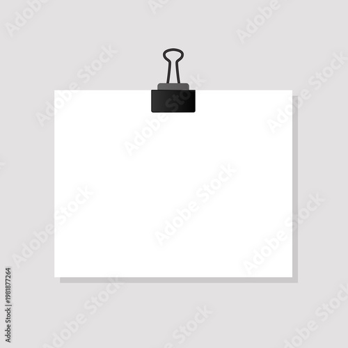 A white blank sheet of paper with a paper clip isolated on a gray background. 