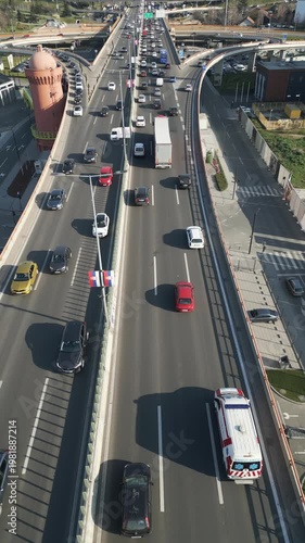Vertical aerial view of heavy traffic on a modern highway bridge in Belgrade, Serbia.